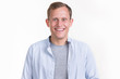 © A Stock Studio - Portrait of a smiling happy young guy on a light background.