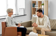 © Syda Productions - psychology, mental therapy and people concept - senior woman psychologist talking to sad young man patient at psychotherapy session