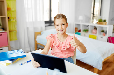 Sticker - children, education and technology concept - happy student girl using tablet computer at home and showing thumbs up