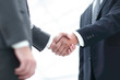 © ASDF - Close up image of business handshake at meeting.