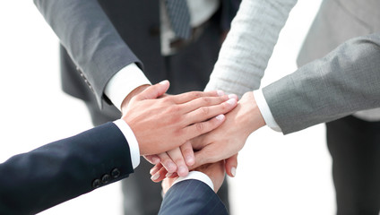 Top view of young people putting hands together