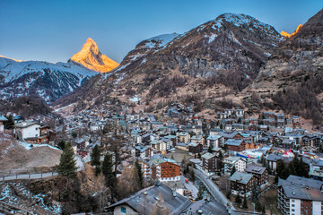 Wall Mural - Beautiful view of of the Matterhorn Mountain and Zermatt village at sunrise, Switzerland