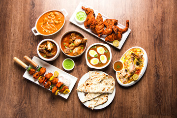 Assorted Indian Non Vegetarian food recipe served in a group. Includes Chicken Curry, Mutton Masala, Anda/egg curry, Butter chicken, biryani, tandoori murg, chicken-tikka and naan/roti