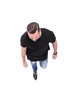 © ASDF - top view. young man in black t-shirt stepping forward