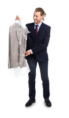 Businessman with clothes after dry-cleaning on white background