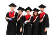 © Pixel-Shot - Young students in bachelor robes on white background