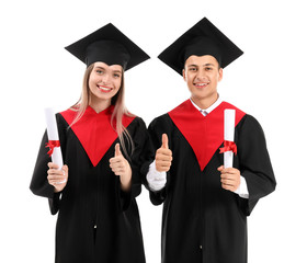 Sticker - Young students in bachelor robes and with diplomas on white background