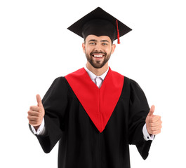 Sticker - Young male student in bachelor robe showing thumb-up on white background