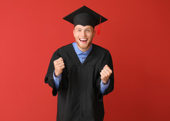 Sticker - Happy male student in bachelor robe on color background