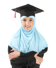 Wall Mural - Muslim female graduate on white background