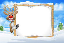 Christmas Reindeer Peeking Around A Sign In A Snowy Scene Winter Landscape Cartoon