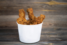 Fried, Chicken Legs In A Grill Batter On An Old Wooden Background