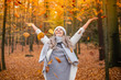© MrsLePew - Casual young woman enjoying autumn season at forest
