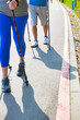 © MDBPIXS - Senior couple with hiking poles walking on footpath at park