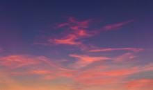 Cloudscape At Dusk With Red Clouds