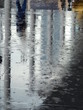 wet floor after rain with water reflection in street