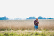 © MDBPIXS - Senior farmer checking wheat crop to harvest in field