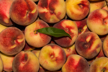 Peach Background. Texture background of sweet red ripe peaches. Ripe peaches close-up.