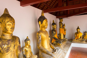 golden buddha at Wat Phra Borommathat Chaiya in Chaiya, Surat Thani, Thailand.