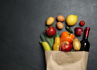 Sticker - Paper bag with groceries on grey background, flat lay