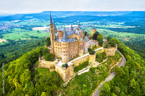 Hohenzollern Castle on mountain, Germany. This castle is a famous landmark in Stuttgart vicinity. Aerial panoramic view of Burg Hohenzollern in summer. Landscape of Swabian Alps with Gothic castle.