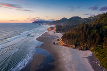 Aerial View Of Arch Cape, Oregon. Sunset Along The Oregon Coast Near Cannon Beach Features White Sand Beaches With Fir And Cedar Forests As Far As The Eye Can See. 