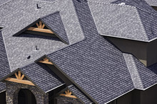 Rooftop In A Newly Constructed Subdivision In Kelowna British Columbia Canada Showing Asphalt Shingles