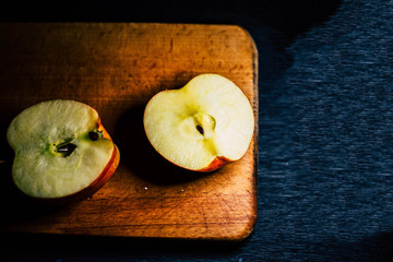 Wall Mural - Sliced apple on a wooden board