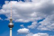Berlin television tower top with white clouds