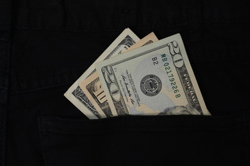 dollar banknote in jeans pocket