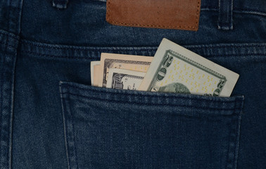 dollar banknote in jeans pocket