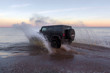 © Павел Ващенков - Black jeep on a sandy beach