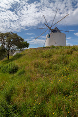 Wall Mural - Old windmill on a hill in Odeceixe at the Algarve, Portugal.