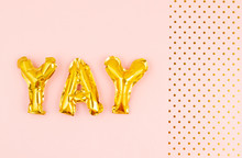 Inflated Letters Yay Ove The Pastel Background With Golden Polka Dots. Party, Celebration, Holidays