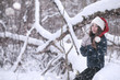 © alexkich - Girl in a winter park in snowfall