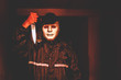 murder, kill and people concept - Criminal or murderer in black wearing a white mask holding knife inside a condo at crime scene