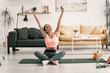 © Yakobchuk Olena - Happy fit female stretching in sitting-room stock photo