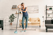© Yakobchuk Olena - Tired female with mop at home stock photo