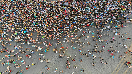 aerial. people crowd on a city square. mass gathering of many people in one place. top view from dro