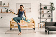 © Yakobchuk Olena - Cheerful lady dancing with mop stock photo
