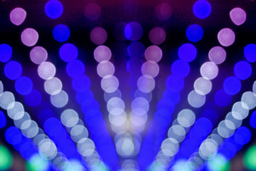 Wall Mural - Closeup blue abstract blurred and bokeh of LED party light bubs reflection lighting at night time.