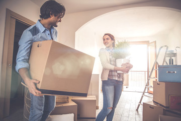 Wall Mural - Young couple moving in into new apartment