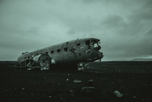 Black Sand Beach In Iceland, With The Plane Wreck