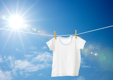 Baby Clothes Hanging On A Clothesline