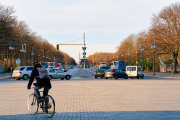 Wall Mural - Man on bicycle Unter den Linden Street in Berlin