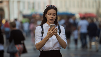 Girl on the street among the crowd of passers-by, photos in the style of surveillance