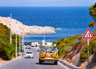 Sticker - Camper car with bicycles driving in highway road Capo Testa