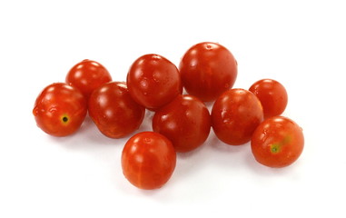 Cherry tomatoes isolated over white background