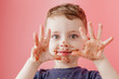 Little boy eating chocolate. Cute happy boy smeared with chocolate around his mouth. Child concept.
