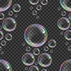 Wall Mural - Seamless pattern with realistic floating soap bubbles with rainbow reflection on transparent background. Design element for advertising booklet, flyer or poster